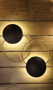 SPELLBINDING  ELLIPTICAL WALL LAMP WITH ANTIQUE TOUCH