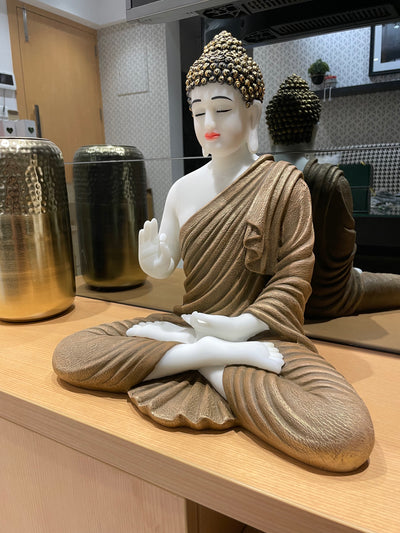 Skillfully handcrafted white and golden Gautam Buddha idol