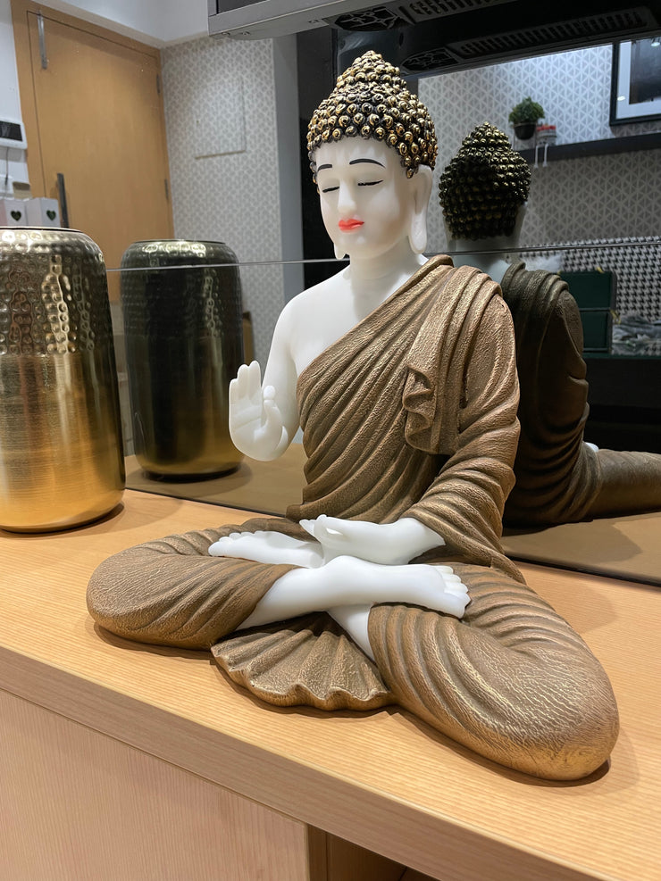 Skillfully handcrafted white and golden Gautam Buddha idol