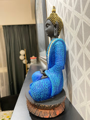 Intricately designed multi colored Gautam Buddha idol