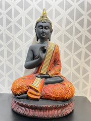 Intricately designed multi colored Gautam Buddha idol
