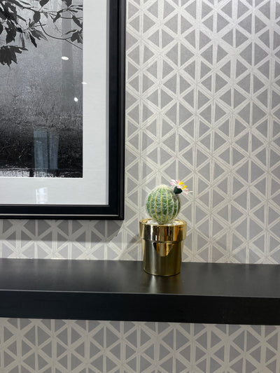 GOLDEN CERAMIC PLANTER WITH ARTIFICIAL LEAVES