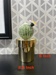 GOLDEN CERAMIC PLANTER WITH ARTIFICIAL LEAVES