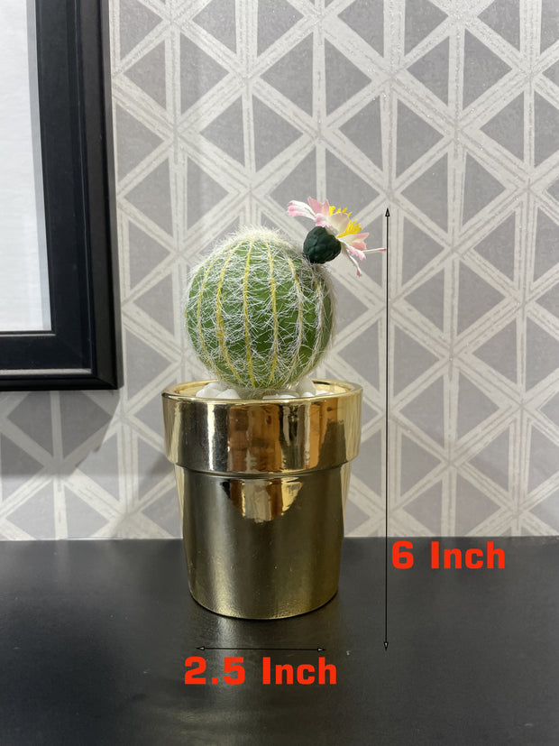 GOLDEN CERAMIC PLANTER WITH ARTIFICIAL LEAVES