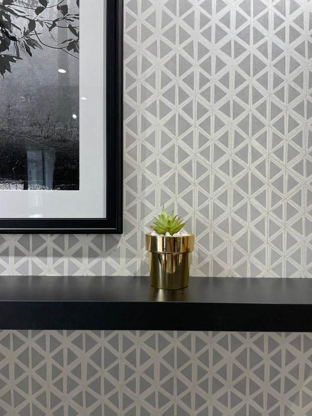 GOLDEN CERAMIC PLANTER WITH ARTIFICIAL LEAVES