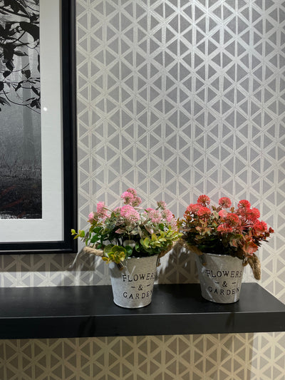 WHITE METAL PLANTER WITH ARTIFICIAL FLOWERS AND LEAVES