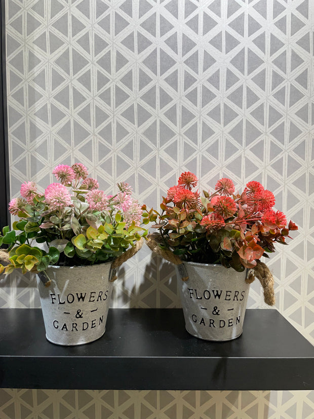 WHITE METAL PLANTER WITH ARTIFICIAL FLOWERS AND LEAVES