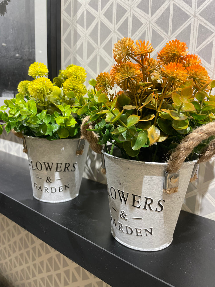 WHITE METAL PLANTER WITH ARTIFICIAL FLOWERS AND LEAVES