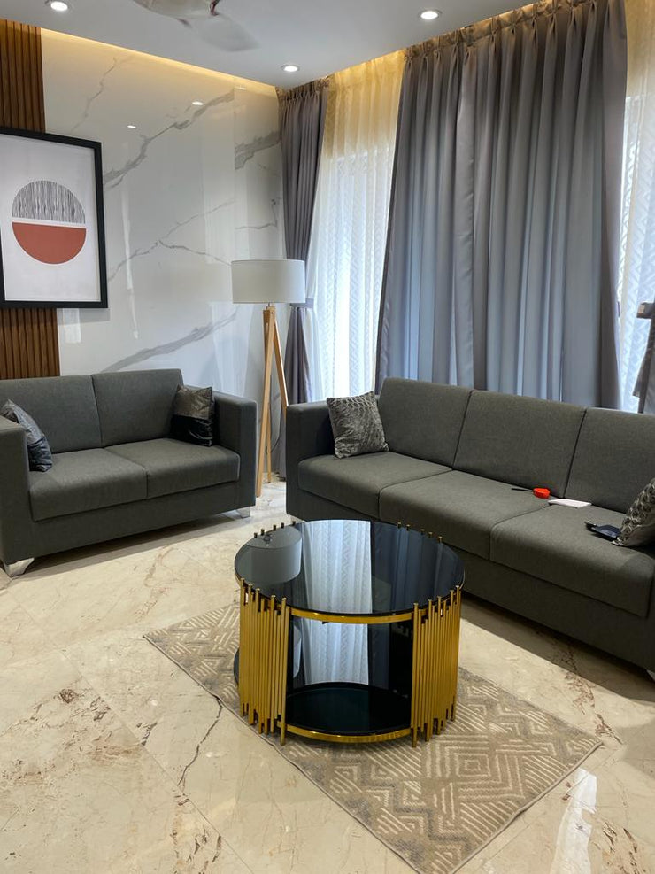 ELLIPTICAL GLASS ANODIZE CENTER TABLE